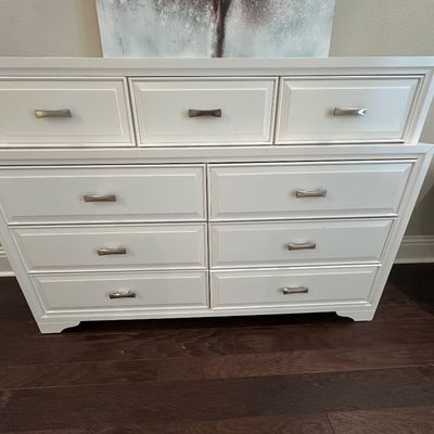 Sale Photo Thumbnail #81: Modern white wood double dresser featuring nine drawers with brushed metal pulls and molded front panels.