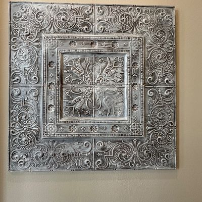 Sale Photo Thumbnail #16: Vintage-style embossed tin wall art panel featuring intricate scrollwork and a distressed white finish.