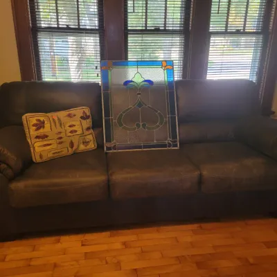 Sale Photo Thumbnail #8: Brown leather Sofa and beautiful stained glass window