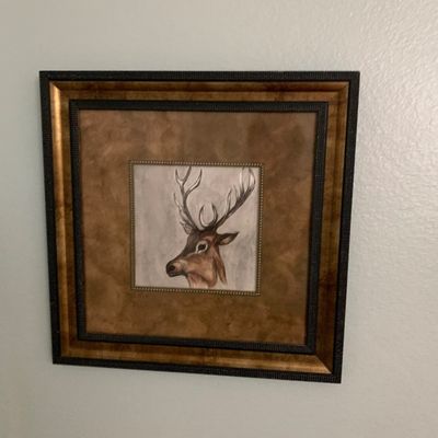 Sale Photo Thumbnail #109: Framed stag portrait print set in a wide multi-tiered frame with textured black and faux-burled wood trim.