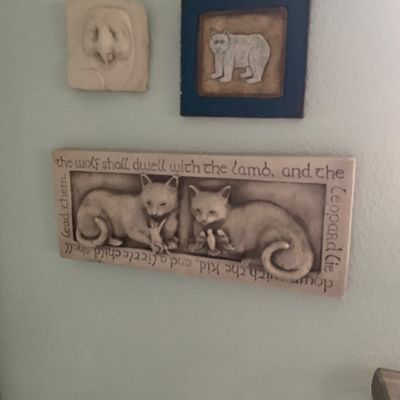 Sale Photo Thumbnail #91: Collection of three wall art pieces, including a stone-look relief plaque featuring felines and a biblical quote, a small bear framed print, and an owl carving.