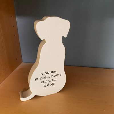 Sale Photo Thumbnail #71: White dog-shaped wooden tabletop sign featuring the phrase "a house is not a home without a dog".