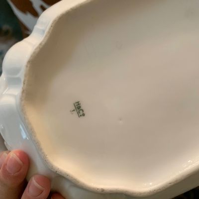 Sale Photo Thumbnail #128: Underside of a white Haviland & Co. porcelain dish showing the maker's mark.