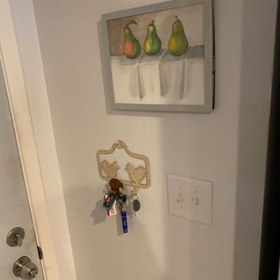 Sale Photo Thumbnail #26: Framed still life painting depicting three pears, displayed on a wall above a bird-motif key holder.