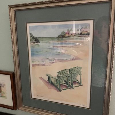 Sale Photo Thumbnail #86: Framed coastal watercolor print depicting green beach chairs on a sandy shore, double-matted in a silver-toned beaded frame.