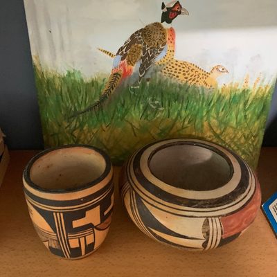 Sale Photo Thumbnail #70: Two Southwestern-style hand-painted terracotta pottery vessels, paired with an original oil painting depicting pheasants in a field.