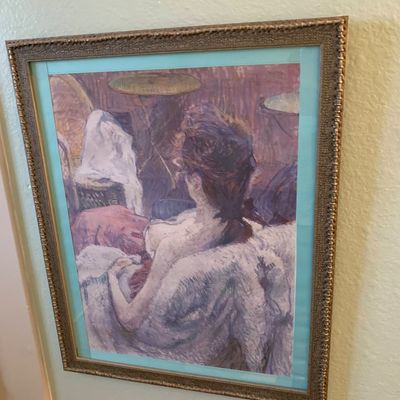 Sale Photo Thumbnail #97: Framed Impressionist-style art print depicting a seated woman, double-matted in teal and housed in a textured bronze-toned frame.