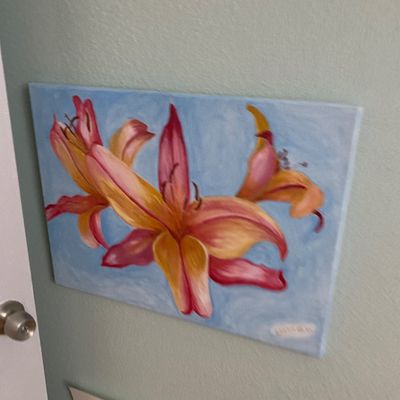 Sale Photo Thumbnail #127: Original floral oil painting on stretched canvas featuring pink and yellow lilies against a light blue background.