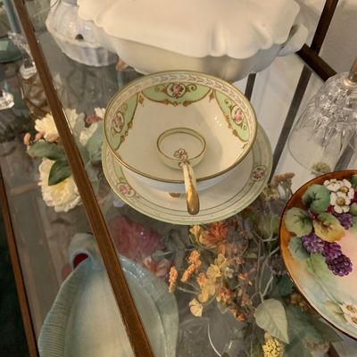Sale Photo Thumbnail #130: Vintage hand-painted porcelain mayonnaise or sauce bowl with matching saucer, spoon, and gold accents, displayed alongside a white covered tureen.