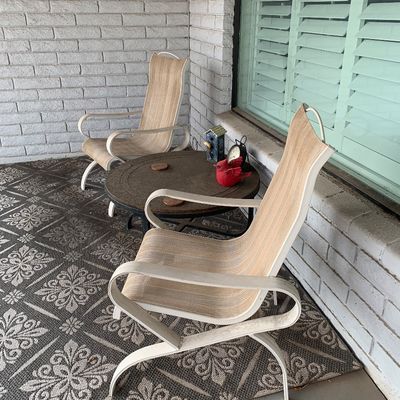 Sale Photo Thumbnail #134: Pair of vintage Homecrest-style outdoor lawn chairs with white metal frames and tan mesh seating, paired with a small round patio coffee table.