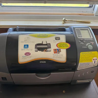 Vintage Epson Stylus Photo 825 inkjet printer featuring a built-in LCD screen and original feature stickers.