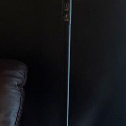 Sale Photo Thumbnail #12: Modern black LED torchiere floor lamp featuring an upper reading light and integrated touch-control buttons on the pole.