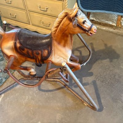 Sale Photo Thumbnail #89: Vintage molded plastic spring rocking horse mounted on a metal frame, showing light paint wear consistent with age and use.