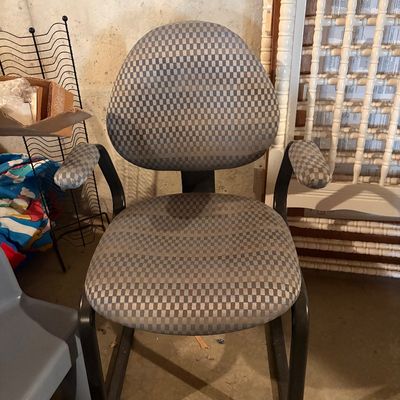 Sale Photo Thumbnail #127: Vintage office armchair with grey checkered fabric upholstery and black metal sled base frame.