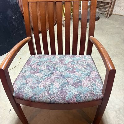 Sale Photo Thumbnail #100: Wooden armchair with vertical slat backrest and patterned leaf fabric seat, showing light wear.