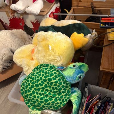 Sale Photo Thumbnail #56: An assortment of large plush stuffed animals, including a green sea turtle, a yellow duck, a Pokémon Snorlax, and a holiday polar bear.