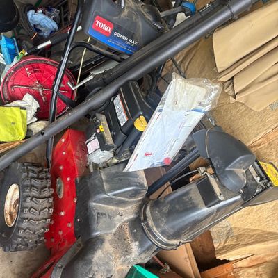 Sale Photo Thumbnail #40: Toro Power Max 726 OE gas-powered snow blower with electric start, showing light wear from use.