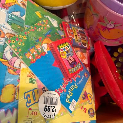 Sale Photo Thumbnail #50: Assortment of vintage children's activity books, card games, crayons, and a Wilson volleyball.