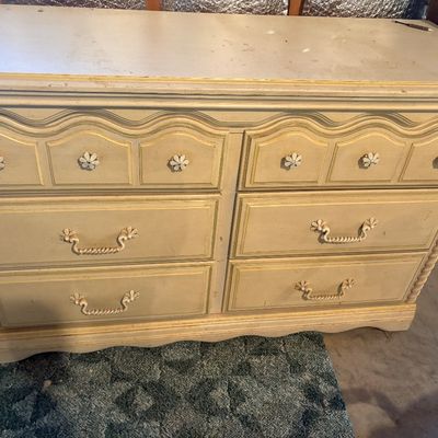 Sale Photo Thumbnail #91: French Provincial style double dresser in cream paint with gold trim, featuring daisy-style knobs, rope-twist bail handles, and twisted rope side detailing.