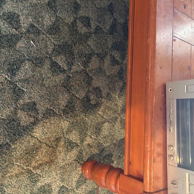 Sale Photo Thumbnail #96: Vintage wood coffee table with turned legs, featuring a silver stereo component sitting on top.