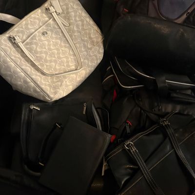 Sale Photo Thumbnail #64: Collection of assorted handbags, backpacks, and small leather goods, including a white signature pattern Coach tote.