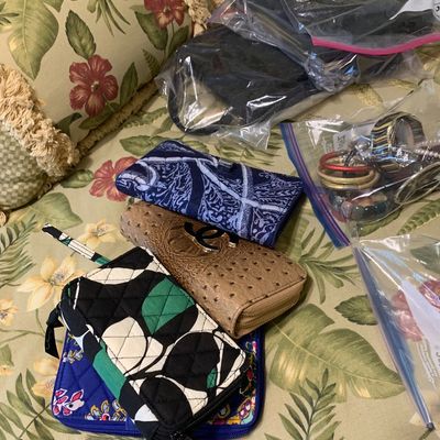 Sale Photo Thumbnail #100: Collection of assorted wallets, wristlets, and fashion jewelry bagged for sale, including quilted Vera Bradley style patterns.