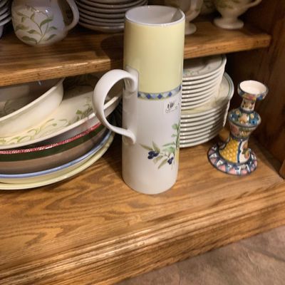 Sale Photo Thumbnail #57: Villeroy & Boch French Garden tall ceramic pitcher displayed in a wooden cabinet among matching dinnerware and a hand-painted candlestick holder.