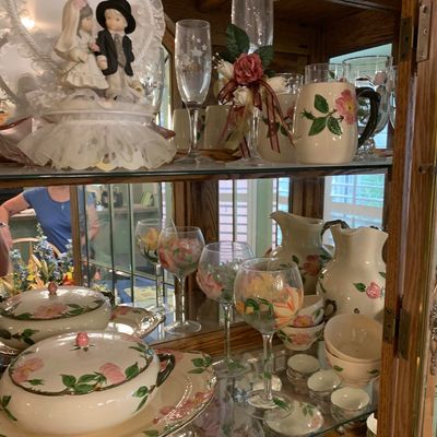Sale Photo Thumbnail #51: Collection of Francisann Desert Rose dinnerware and hand-painted floral glassware displayed inside a wooden curio cabinet alongside vintage wedding memorabilia.