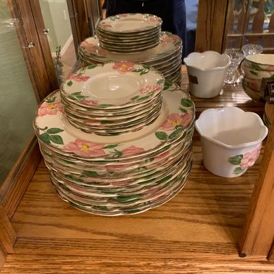 Sale Photo Thumbnail #53: Franciscan Desert Rose pattern ceramic dinnerware set displayed inside a wooden hutch cabinet.