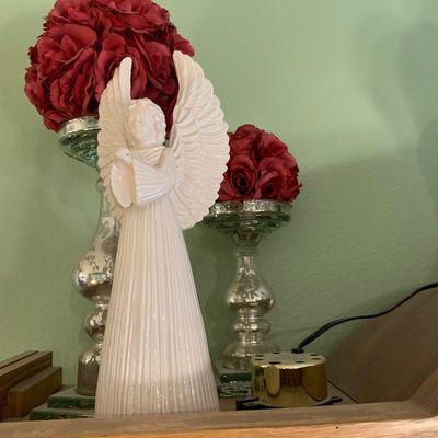 Sale Photo Thumbnail #49: White glazed ceramic praying angel figurine, displayed with mercury glass candle holders and faux red floral arrangements.