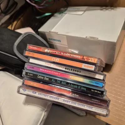 Sale Photo Thumbnail #53: Stack of late 1990s pop CDs in jewel cases, including albums by Britney Spears, Celine Dion, Mariah Carey, and *NSYNC.