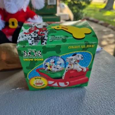 Vintage 1996 Disney's 101 Dalmatians "Dog Sledding" McDonald's promotional snow globe in its original packaging.