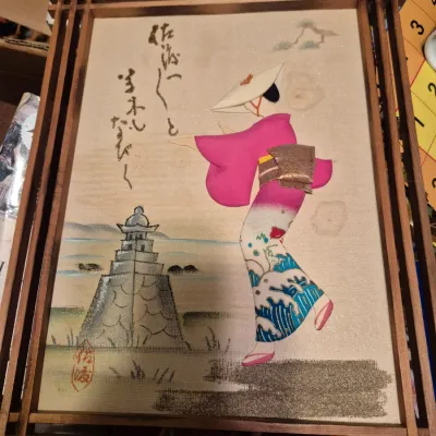 Sale Photo Thumbnail #47: Framed Japanese fabric 3D art picture depicting a dancing figure in a pink and patterned kimono near a stone lantern.