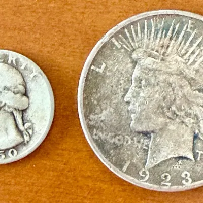 
1923S Liberty Silver Dollar And 1950D Silver Quarter