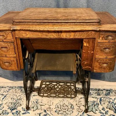 
Antique Treadle Sewing Machine Cabinet With Antique Sewing Machine And Accessories
