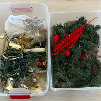(2) Plastic Totes Of Christmas Decor - Greenery, Lighted Angel, Bird Ornaments, And More