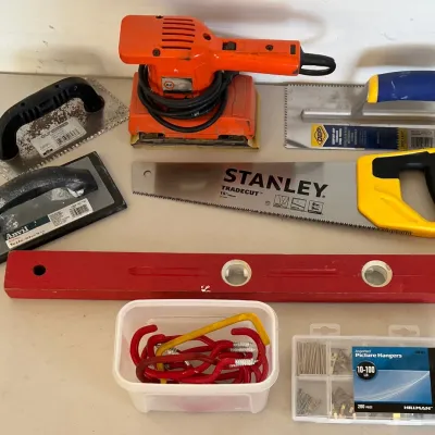 
Tool And Hardware Lot - Stanley Tradecut Saw, Level, Hangers, And Trowels