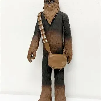 Sale Photo Thumbnail #18: Star Wars Chewbacca action figure with attached bandolier and satchel, in good pre-owned condition.