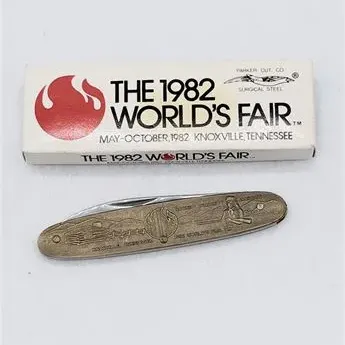 Sale Photo Thumbnail #57: 1982 World's Fair commemorative pocket knife by Parker Cut Co., featuring an etched brass handle depicting Knoxville, Tennessee, and the original box.