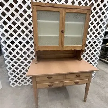 Sale Photo Thumbnail #62: Antique baker's cabinet featuring an upper hutch with etched glass double doors and a lower base with four drawers.