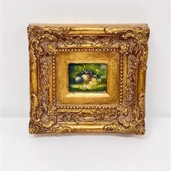 Sale Photo Thumbnail #24: Miniature oil painting of fruit depicting grapes and plums, housed in a heavily ornate gilded baroque-style frame.