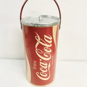 Sale Photo Thumbnail #26: Vintage Coca-Cola insulated drink bucket cooler with a metal lid and swinging wire handle.