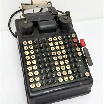 Sale Photo Thumbnail #38: Vintage Burroughs electric adding machine featuring a black metal housing, full key column layout, and paper roll feed mechanism.