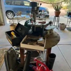 Sale Photo Thumbnail #33: Collection of power tools and equipment, including a drill press, scroll saw, leaf blower attachments, and a metal toolbox