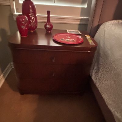 Sale Photo Thumbnail #48: Dark wood three-drawer nightstand topped with red cloisonné-style vases and decorative tray.