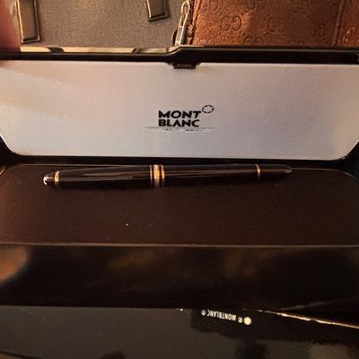 Sale Photo Thumbnail #157: Montblanc black resin pen featuring gold-plated trim, presented in its original hard clamshell display box.