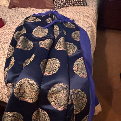 Sale Photo Thumbnail #52: Navy blue satin Chinese brocade skirt featuring metallic gold and pastel embroidered roundels, laid out across a bed.