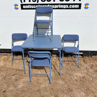 F blue folding card table with four chairs