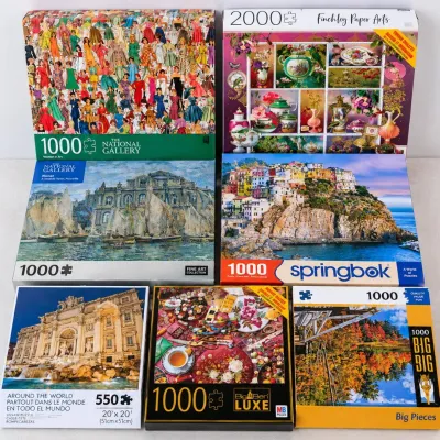 T lot of 7 jigsaw puzzles