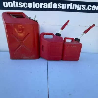 G set of three red gasoline cans